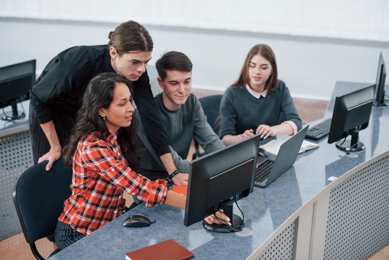 Students collaborating during a practical computer-based session